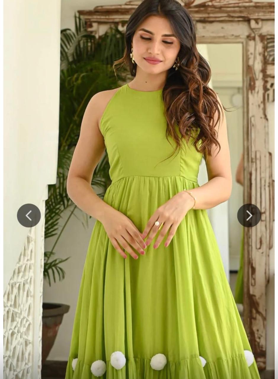 lime green sleeveless flared maxi dress with pom-pom hem