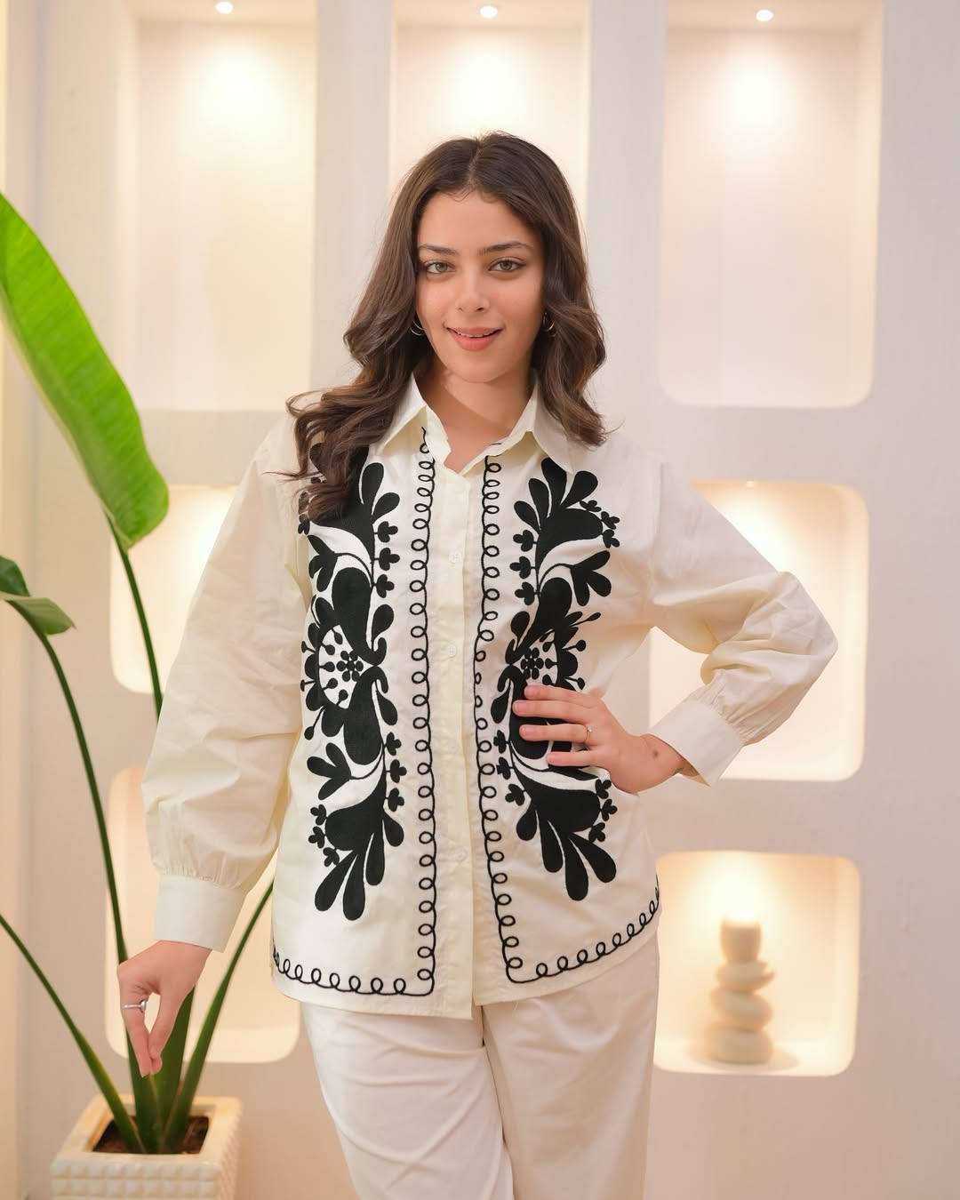 ivory ensemble with bold black embroidery