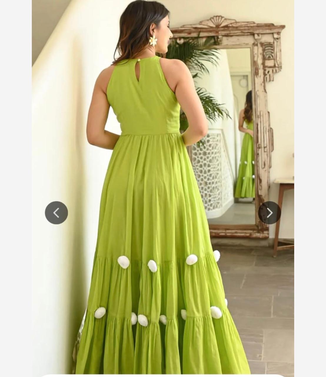 lime green sleeveless flared maxi dress with pom-pom hem