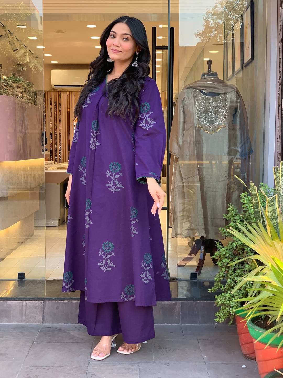 elegant plum kurta set with floral motifs