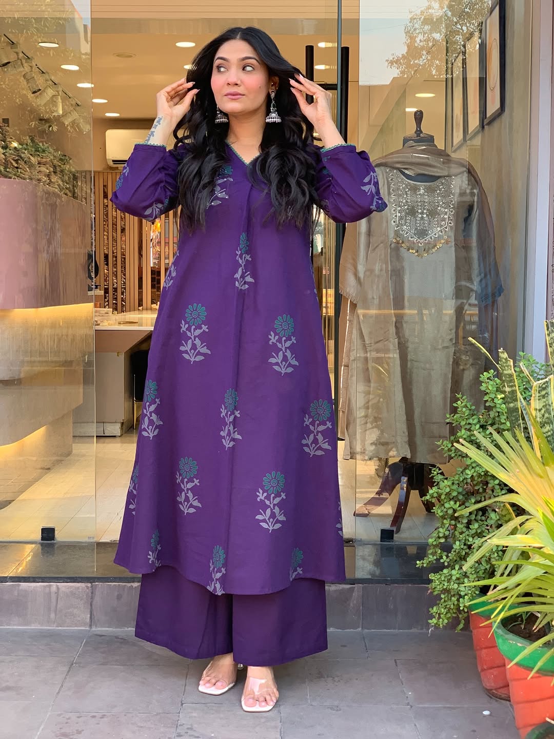 elegant plum kurta set with floral motifs